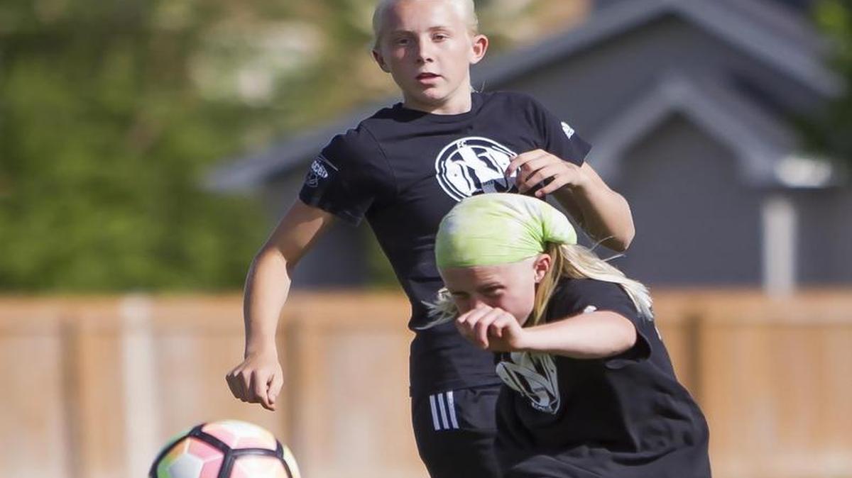 Sammy Smith, 11, fires toward the goal during drills Thursday with her sister Logan Smith, 13, at FC Nova’s practice facility. Nova Elite opened the Idaho State Cup on Saturday with a 7-0 win against Meridian United, then followed with an 8-0 victory against Nampa Premier.