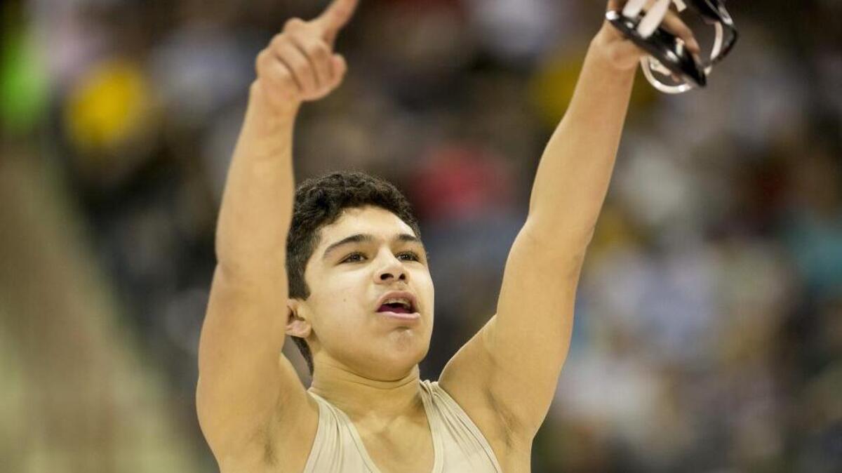 Columbia’s Angel Rios celebrates his 120-pound, 5A state championship last year at Nampa’s Ford Idaho Center. Rios is one of three returning state champions for Columbia.