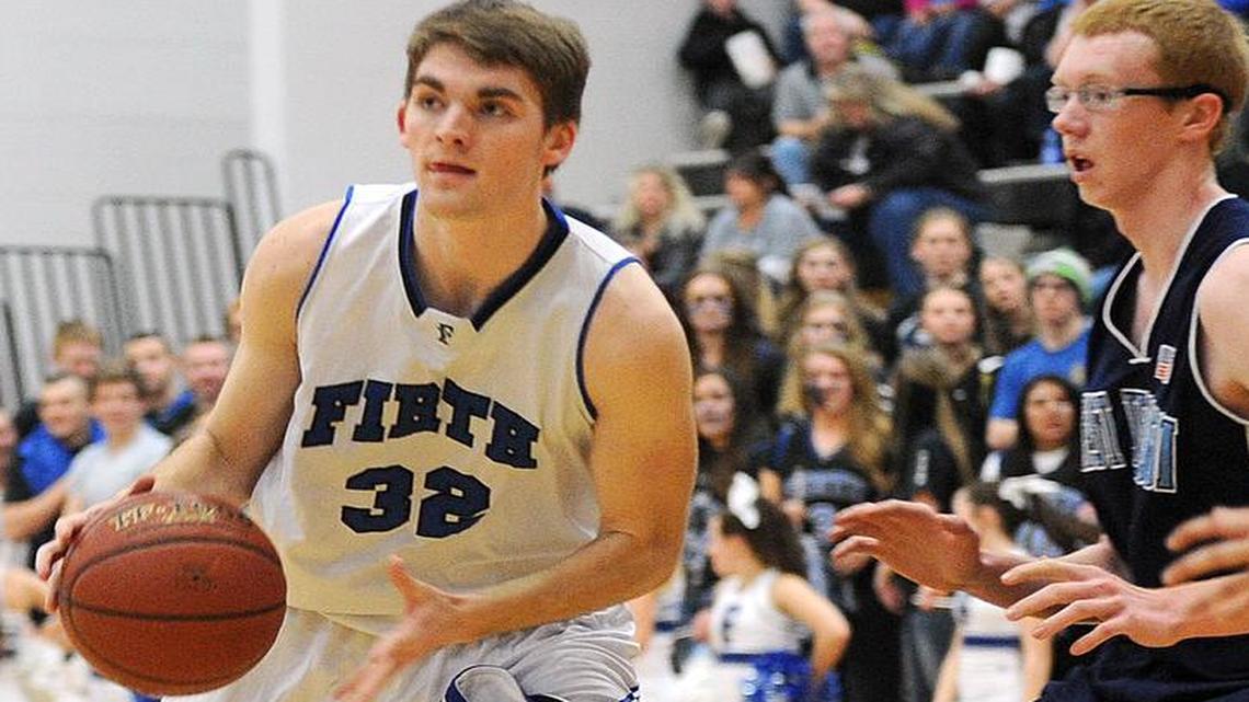 Firth’s Connor Burkart looks for a teammate to dish it off to against West Jefferson during the District Six Tournament on Feb. 24 at South Fremont High.