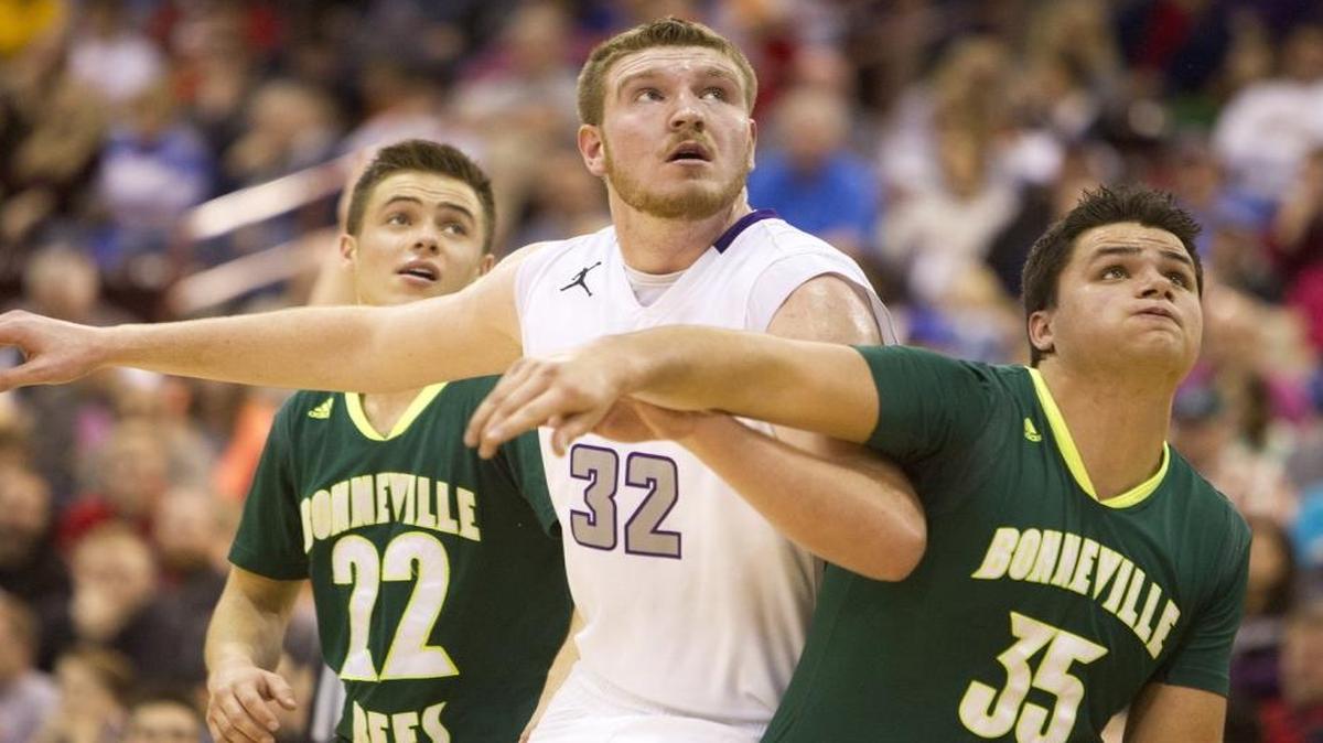Senior Kolby Lee, center, and Rocky Mountain defeated Bonneville 61-56 in the first round of the 5A state tournament Thursday at the Ford Idaho Center in Nampa.