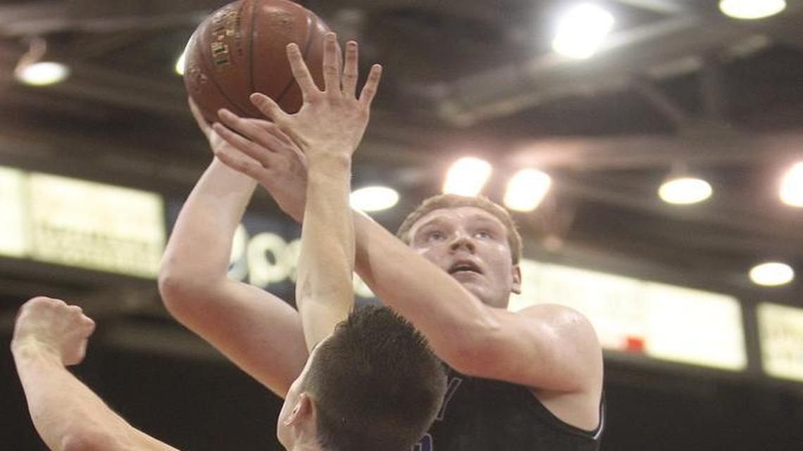 Rocky Mountain’s Kolby Lee rises up for a shot against Madison during the first round of the 5A state tournament March 3 at the Ford Idaho Center.