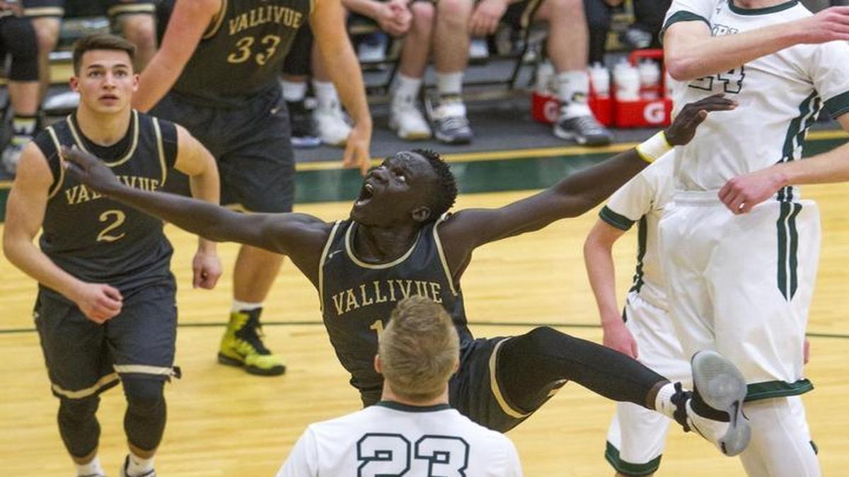 Vallivue’s Amoro Lado watches his shot drop into the basket during the Falcons’ victory over Burley in the 4A state tournament Thursday at Borah High.