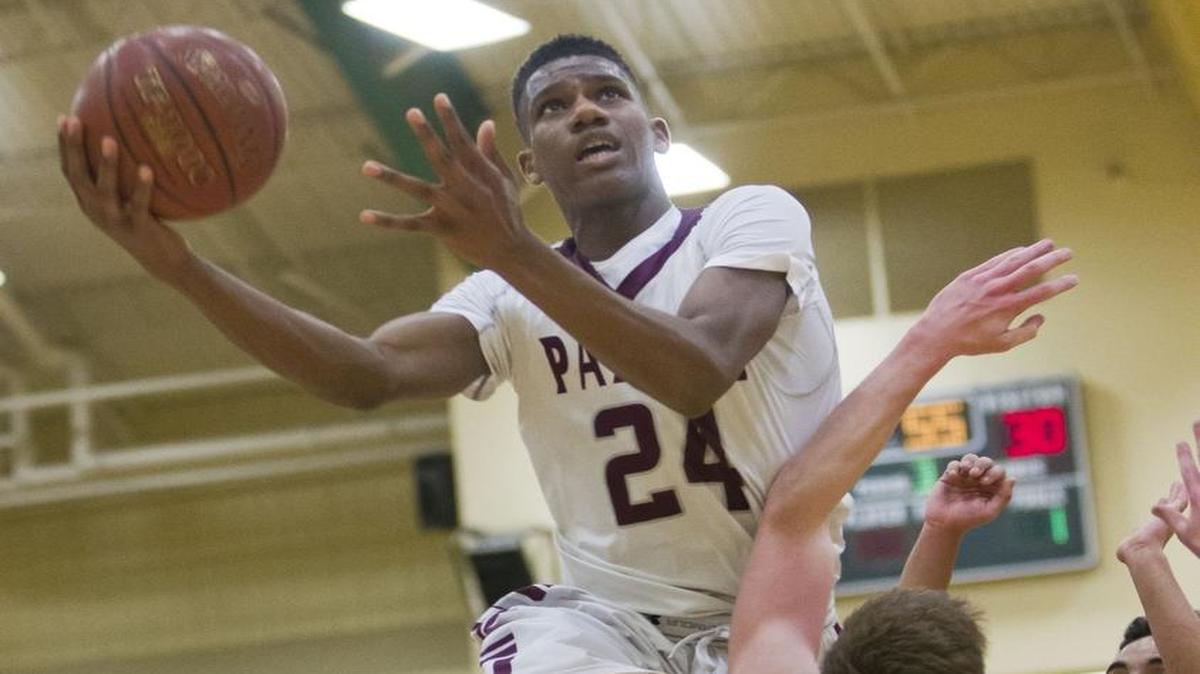 Borah meets Centennial in the 5A District Three boys basketball championship Friday Feb. 26, 2016, at Borah High School in Boise. The Lions defeated the Patriots 43-32.