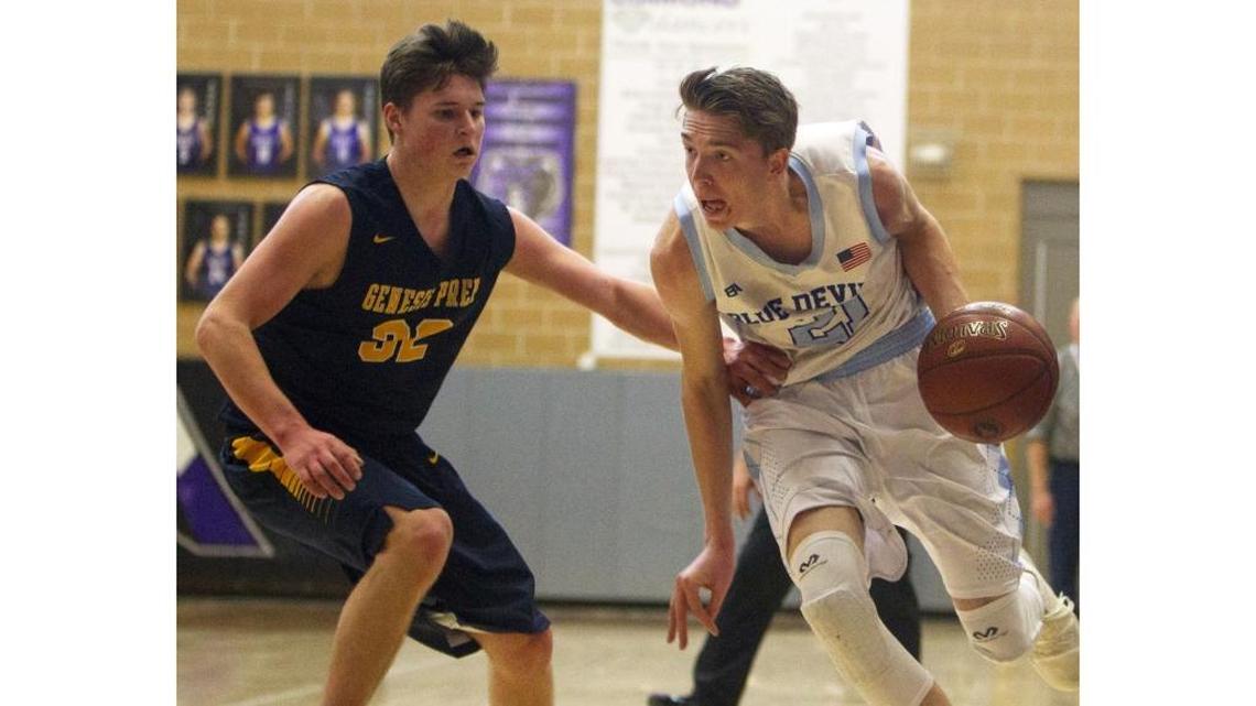 Dietrich senior Slade Dill dribbles past Genesis Prep junior Jacob Schutz on March 2 during the 1A-DII boys basketball state tournament at Rocky Mountain High in Meridian.