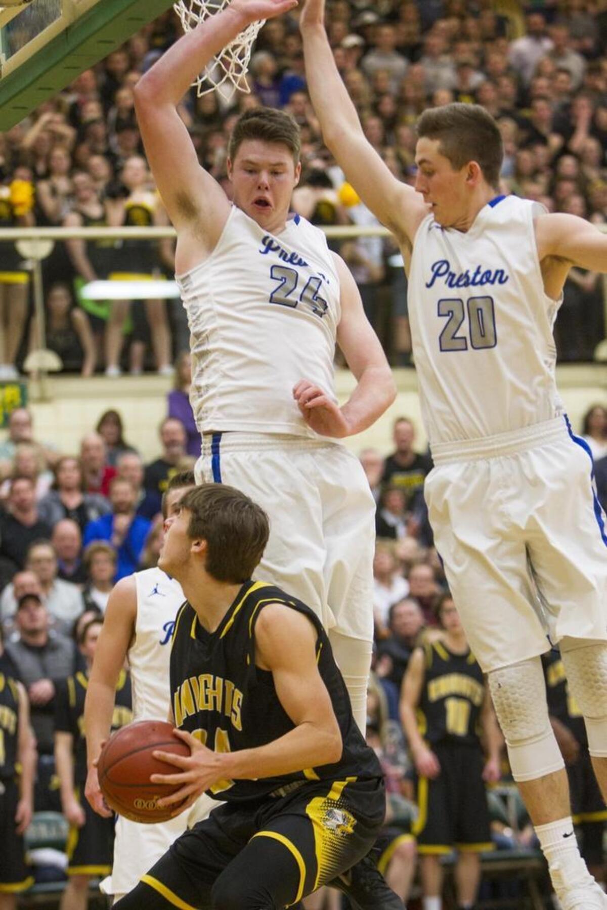 Preston center Braydon Parker, left, rises to block a shot at during last year’s 4A state semifinals. Parker is verbally committed to Idaho State.