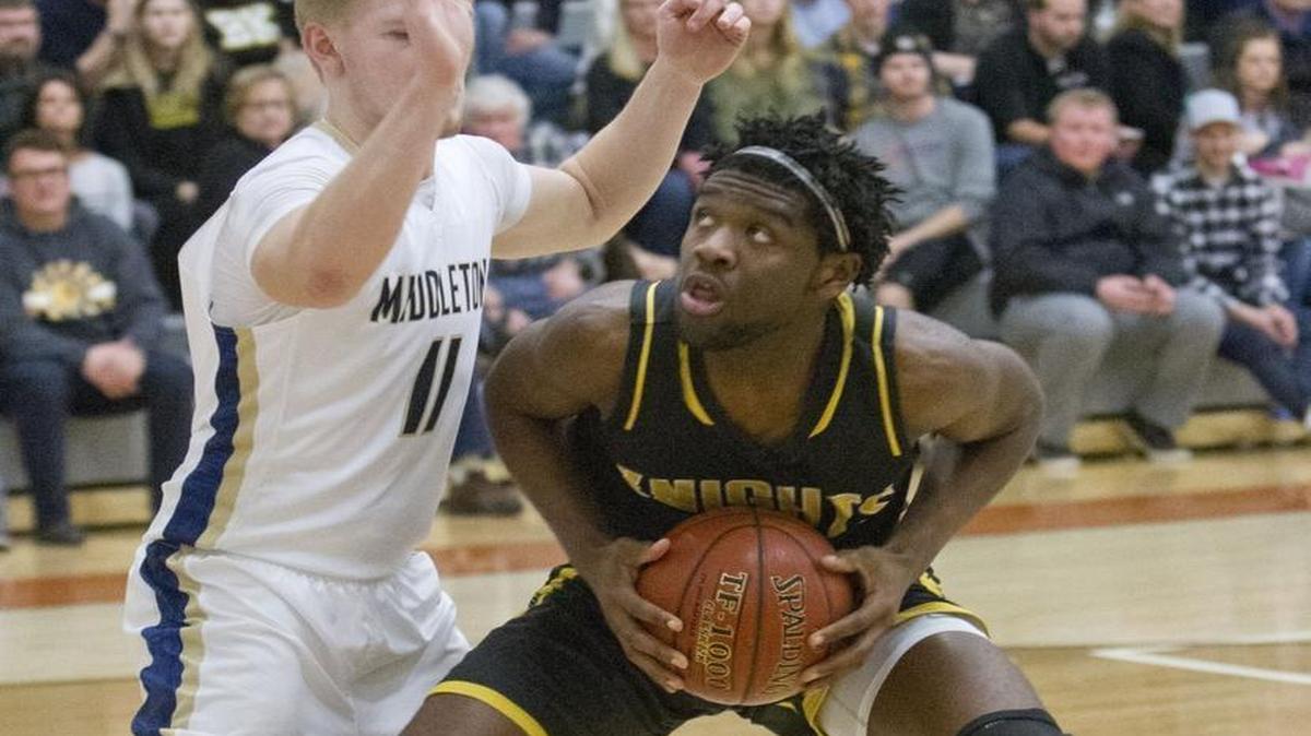 Bishop Kelly’s Raoul Johnson eyes the basket in the 4A District Three Tournament championship against Middleton on Feb. 23 at Ridgevue High.