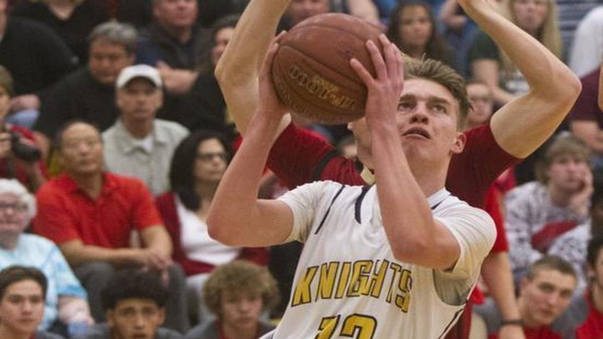 Bishop Kelly’s Max Rice navigates through the Minico defense for a shot in the 4A state semifinals last year at Borah High.