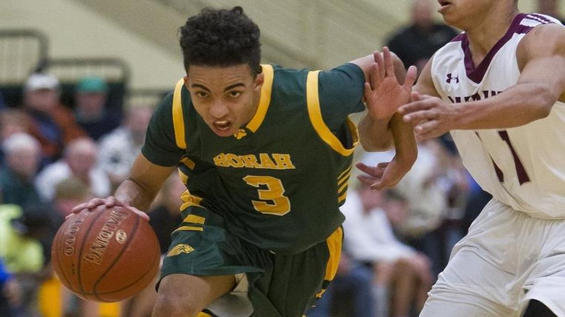 Borah’s DeAndre Jones drives past Centennial’s Talon Pickney during the 5A District Three championship game Feb. 26, 2016 at Borah High.