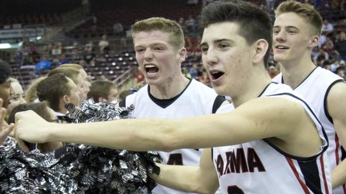 Parma’s Tanner Kramer (3) runs through the crowd after the Panthers’ victory over Fruitland in the state championship game.