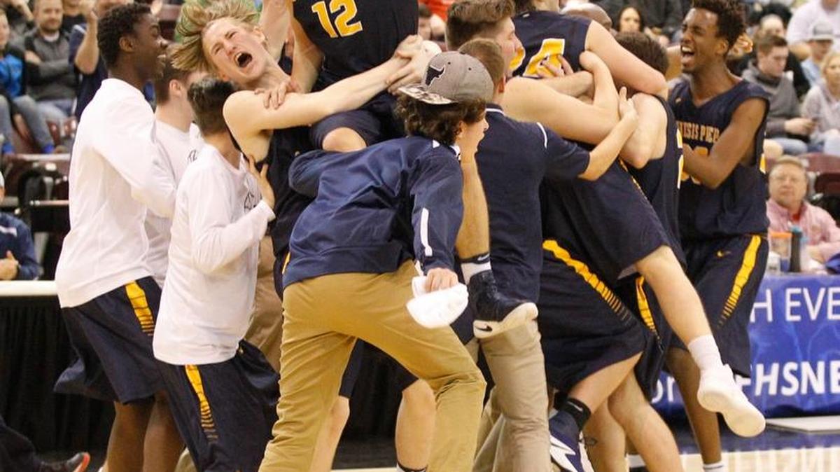 Genesis Prep players celebrate to their 68-62 win over Dietrich in the 1A Division II boys basketball state championship game Saturday at the Ford Idaho Center in Nampa.
