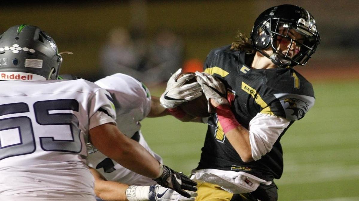 Capital wide receiver Alex Lindsey tries to spin out of a tackle during the Eagles’ 27-22 win over Mountain View for the 5A SIC Pod A championship Oct. 21 at Dona Larsen Park.