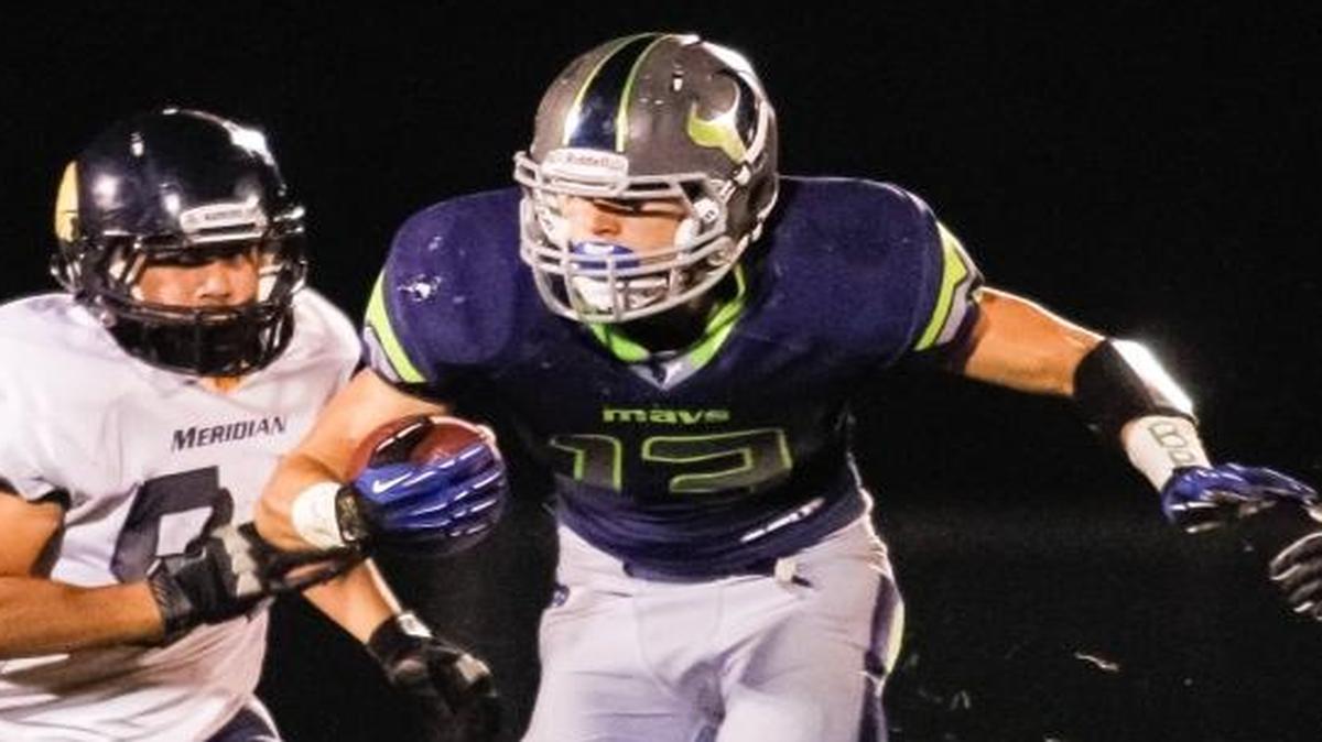 Ex-Mountain View running back Josh Buss looks for running room against Meridian on Nov. 1, 2013.