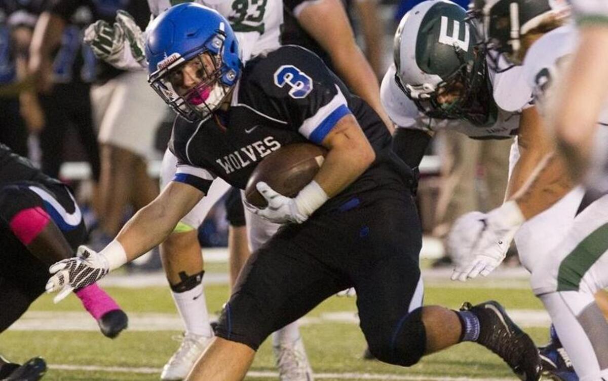 Timberline’s Matt Roberts looks for running room against Eagle on Sept. 29 at Dona Larsen Park.
