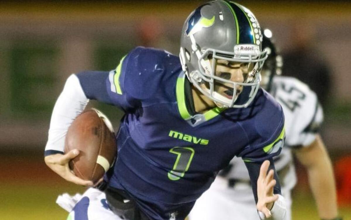 Mountain View quarterback Tucker Rovig runs the ball against Capital in the 5A state football quarterfinals at Mountain View on Nov. 6, 2015. Mountain View won 42-14.