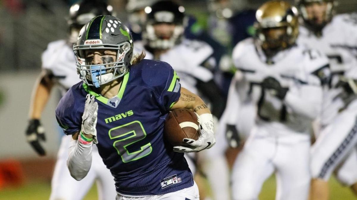 Mountain View’s TreyTon Bell breaks away from the Capital defense during the Mavericks 42-14 win the quarterfinals.