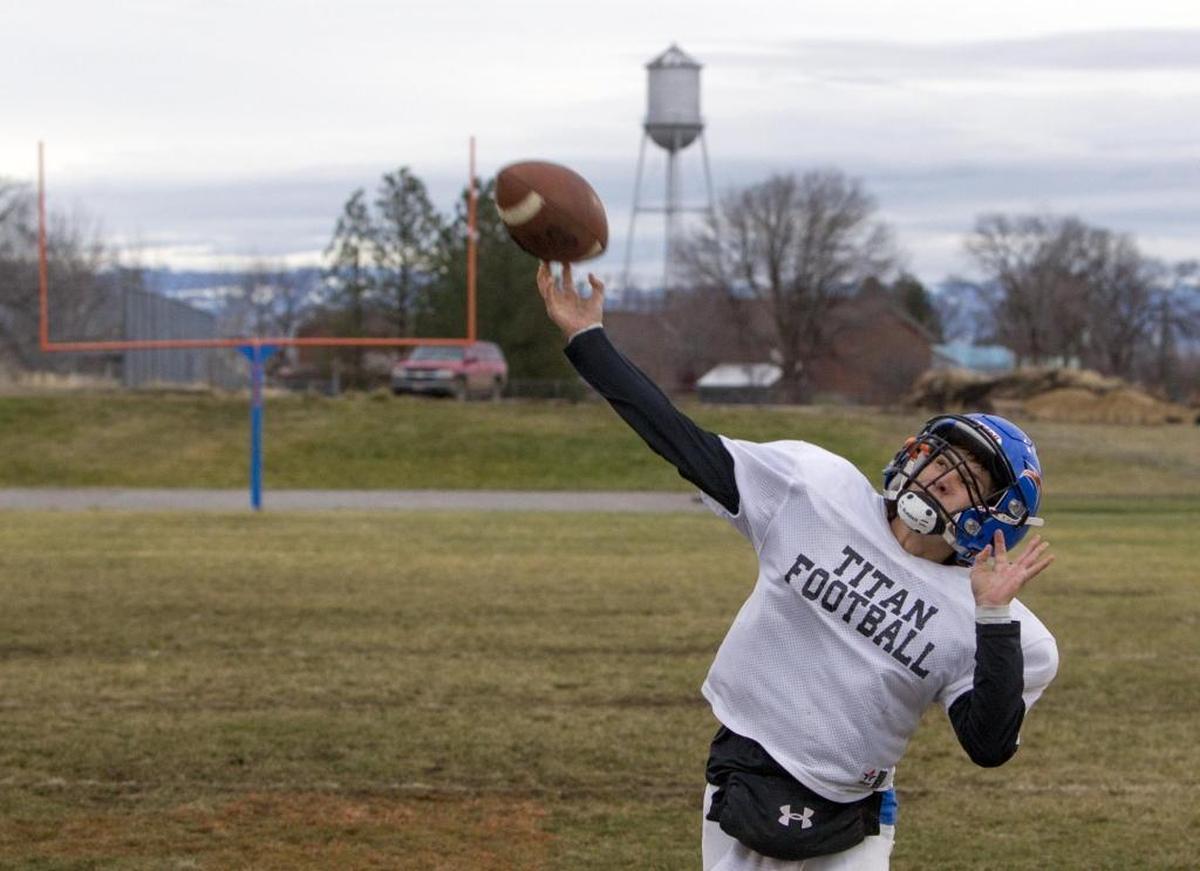 Camridge High junior Jayden Mink plays quarterback for the Tri-Valley Titans and grew up hearing stories about the former rivalry between Cambridge and Midvale.