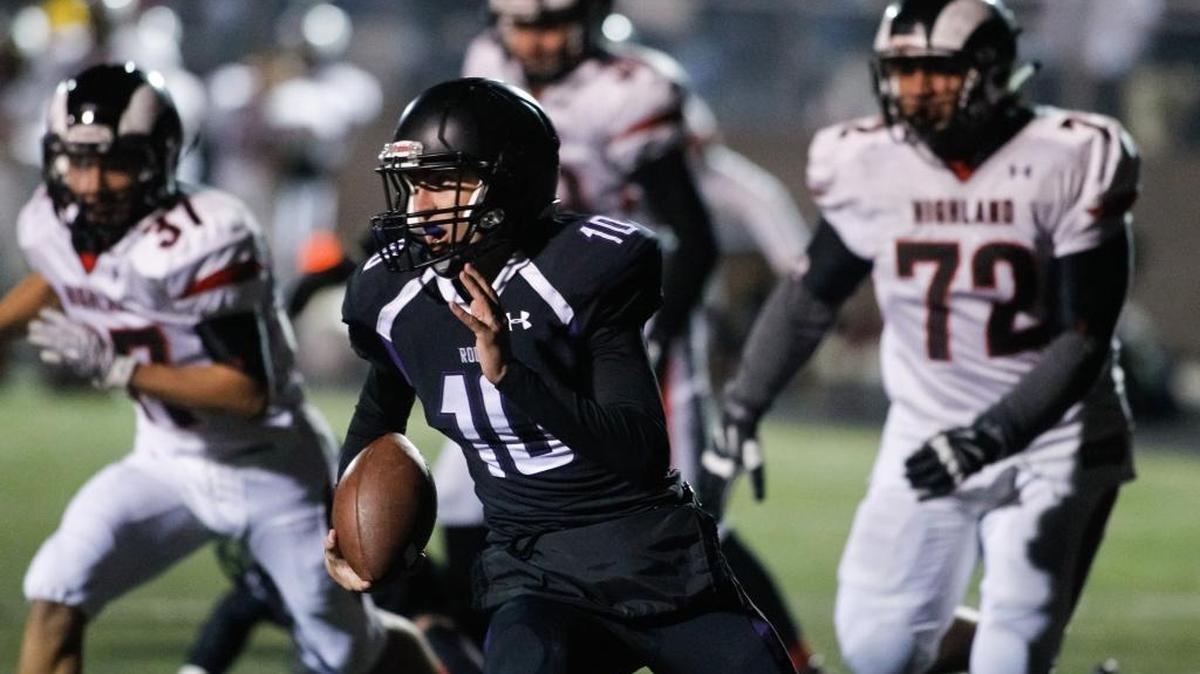 Rocky Mountain quarterback Christian Blaser scrambles toward open field Friday against Highland. Blaser finished with 77 rushing yards, and he threw for a touchdown.