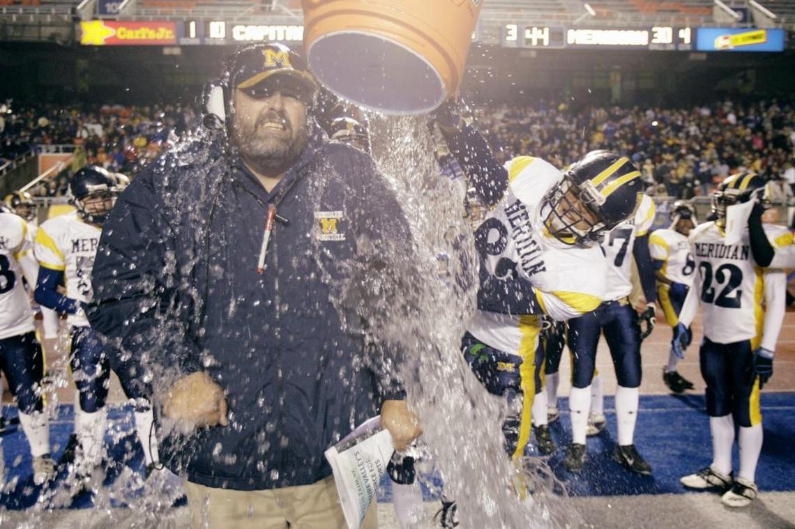 Former Meridian and Payette coach Kip Crofts will take over the Caldwell football program next year. Above, he gets a bucket of ice water poured over him after winning the 2007 5A state title at Meridian.