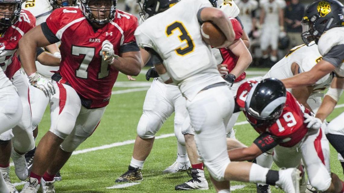 Highland senior defensive tackle Tommy Togiai, left, is one of the most sought-after recruits in the nation.