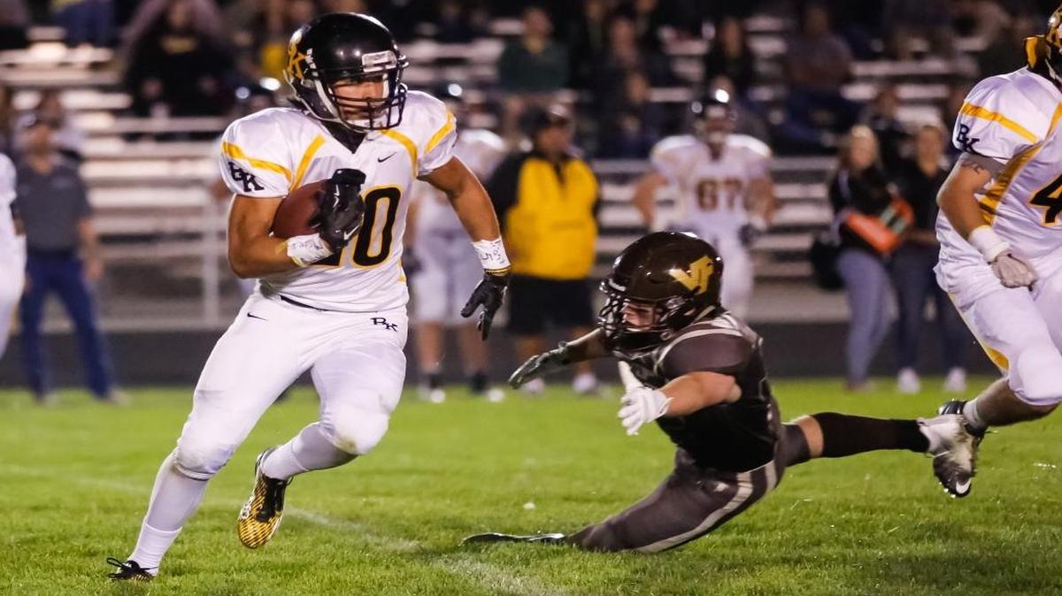 Bishop Kelly's Luke Burley looks for running room in the Knights’ 29-15 win over previously undefeated Vallivue on Friday.