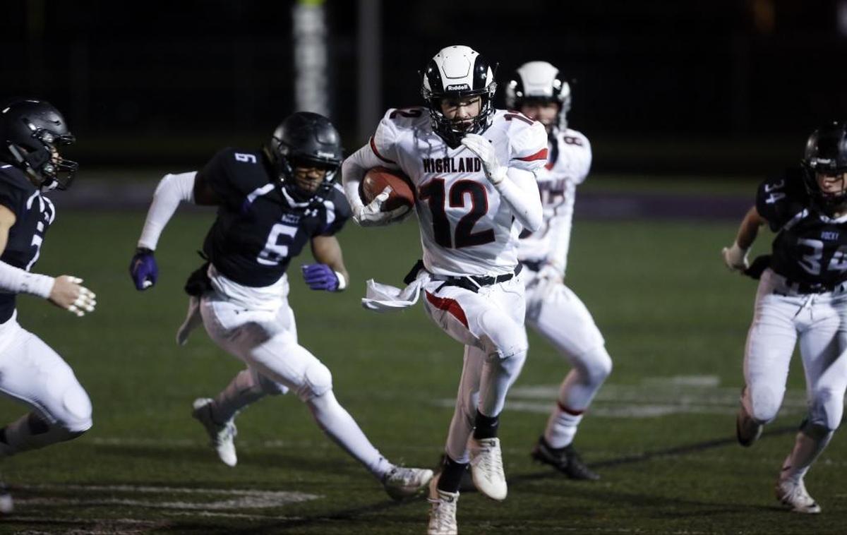 Highland running back Landon Demuzio breaks away from the Rocky Mountain defense during last year’s meeting in the state semifinals.