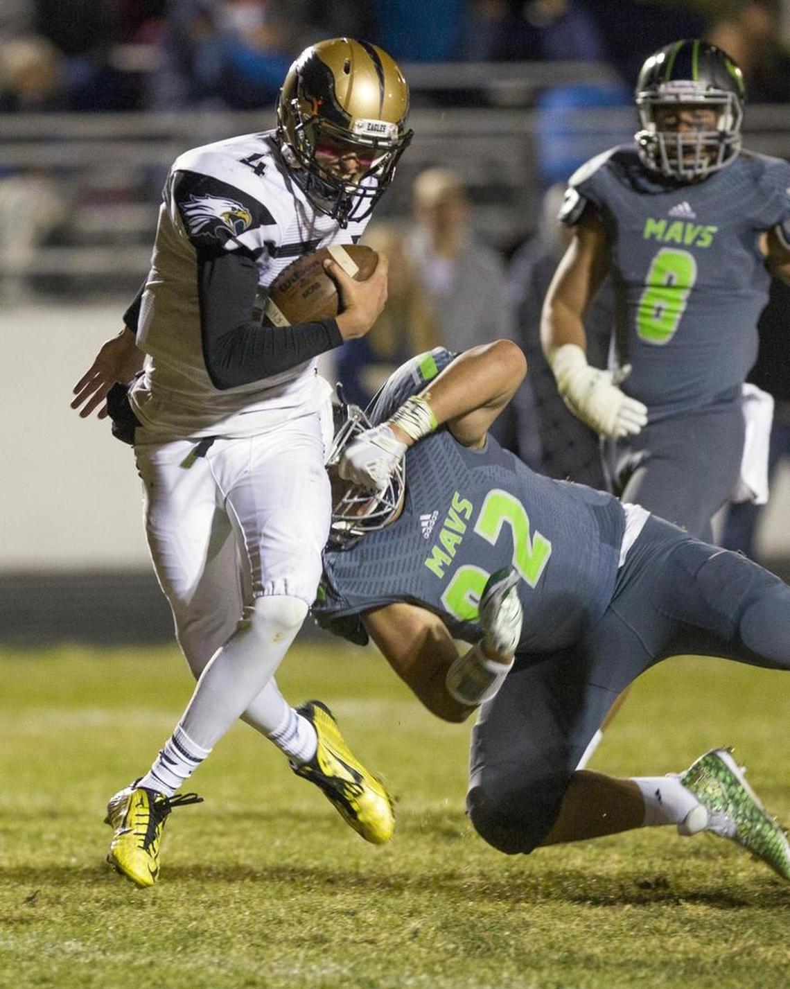 Capital quarterback Ryan Hibbs slips past a Mountain View and into the end zone last season.