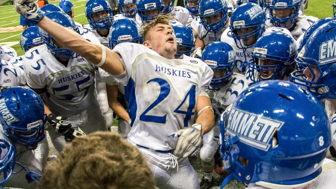 Mason Farnsworth and his teammates celebrate their 54-22 victory over Gooding in the state championship game at Holt Arena in Pocatello on Saturday. Farnsworth had three TDs in a balanced attack as the Huskies scored on offense, defense and special teams to claim the first state football championship in school history.