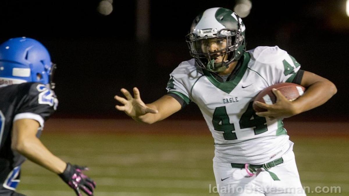 Eagle running back Nathan Duckworth tries to stiff arm a Timberline defender Sept. 29 at Dona Larsen Park.