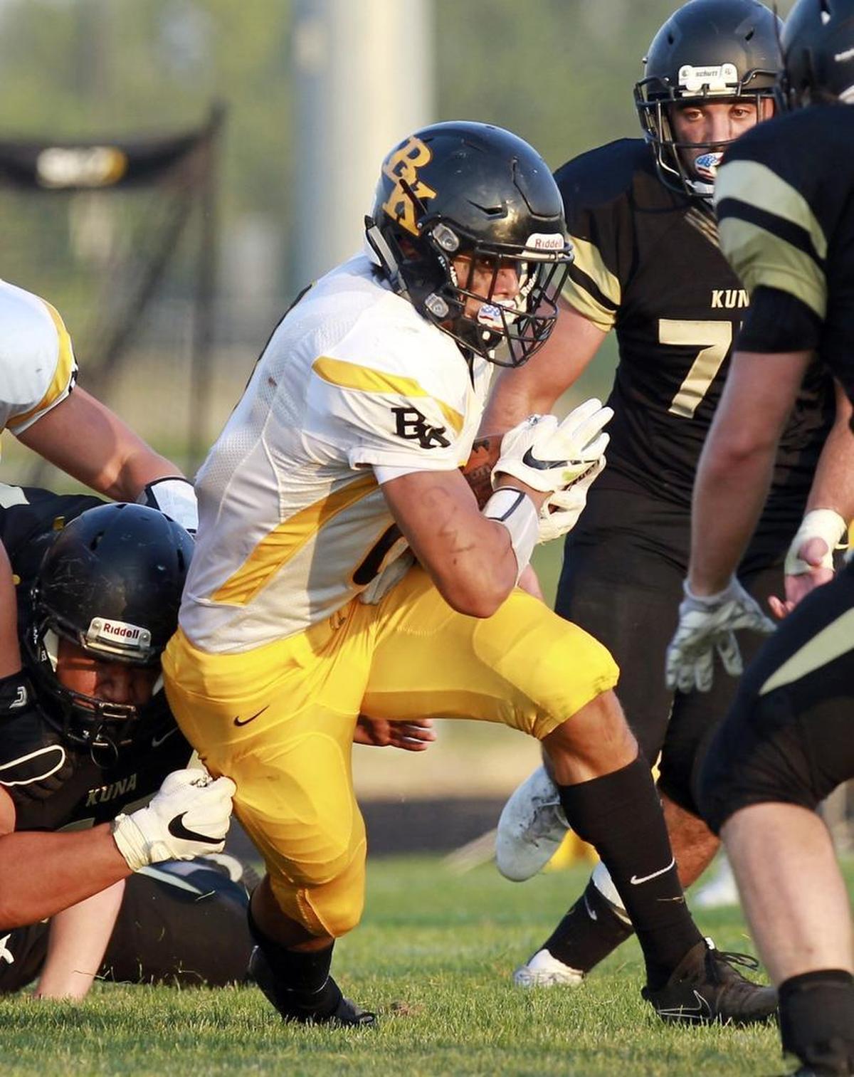 Bishop Kelly’s Cameron Foley runs upfield against Kuna in the season opener for both teams Aug. 25 at Kuna High School.