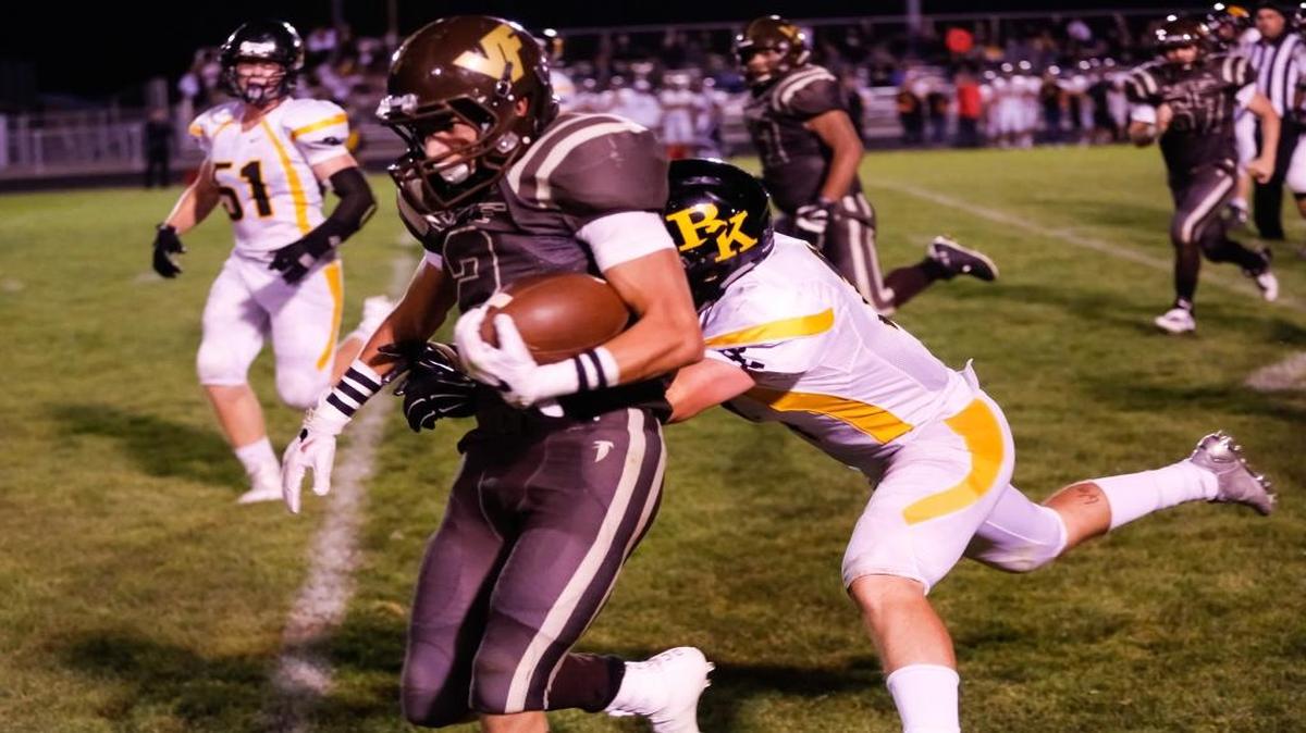 Vallivue running back Jerred Monnier fights for extra yards against Bishop Kelly on Sept. 16.