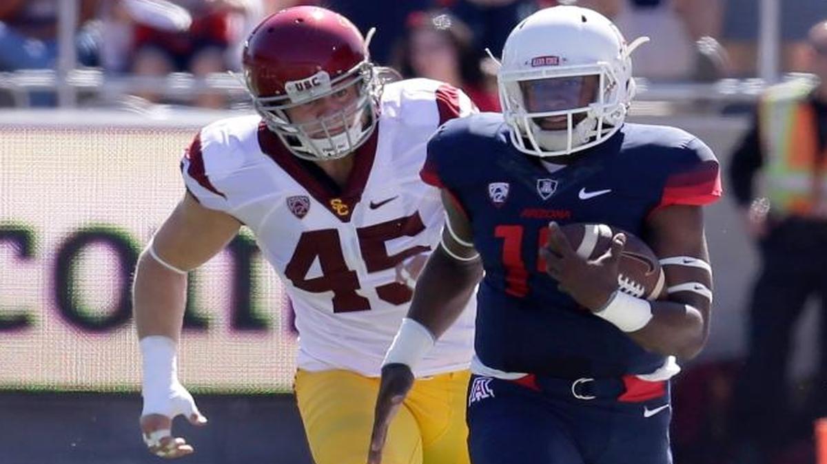 USC defensive end/outside linebacker Porter Gustin chases Arizona quarterback Khalil Tate on Oct. 15 in Tucson, Ariz.