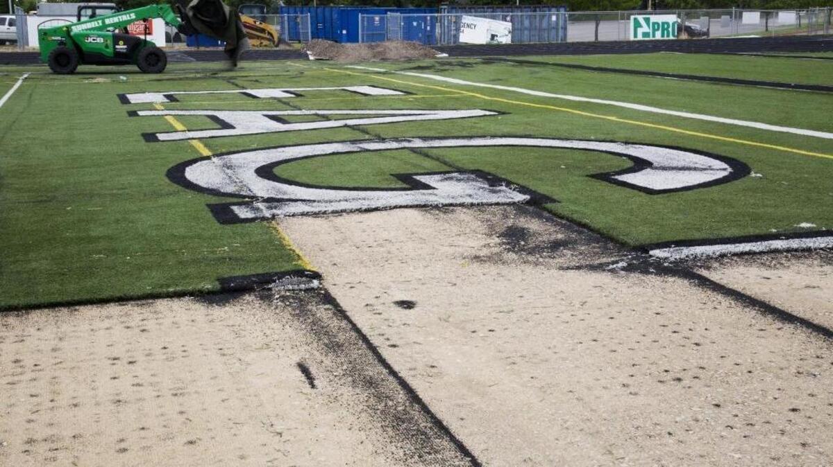 Crews began removing the old turf at Eagle High’s Thunder Stadium in June.