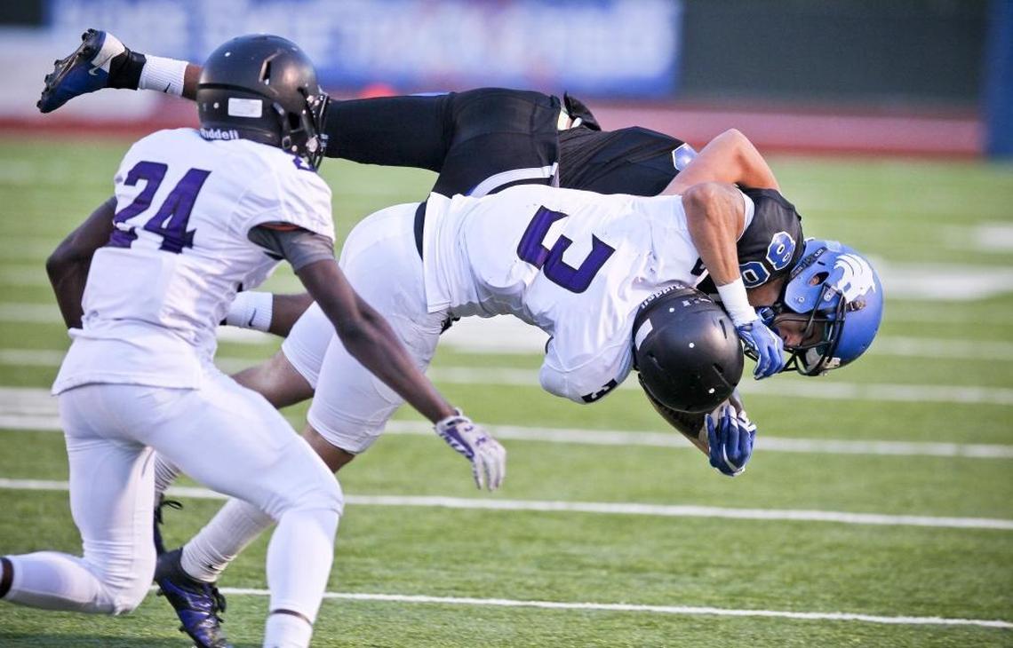 Rocky Mountain’s Cal Criner slams Timberline’s Terek Zimmerman to the turf during an Oct. 1, 2015, game at Dona Larsen Park.
