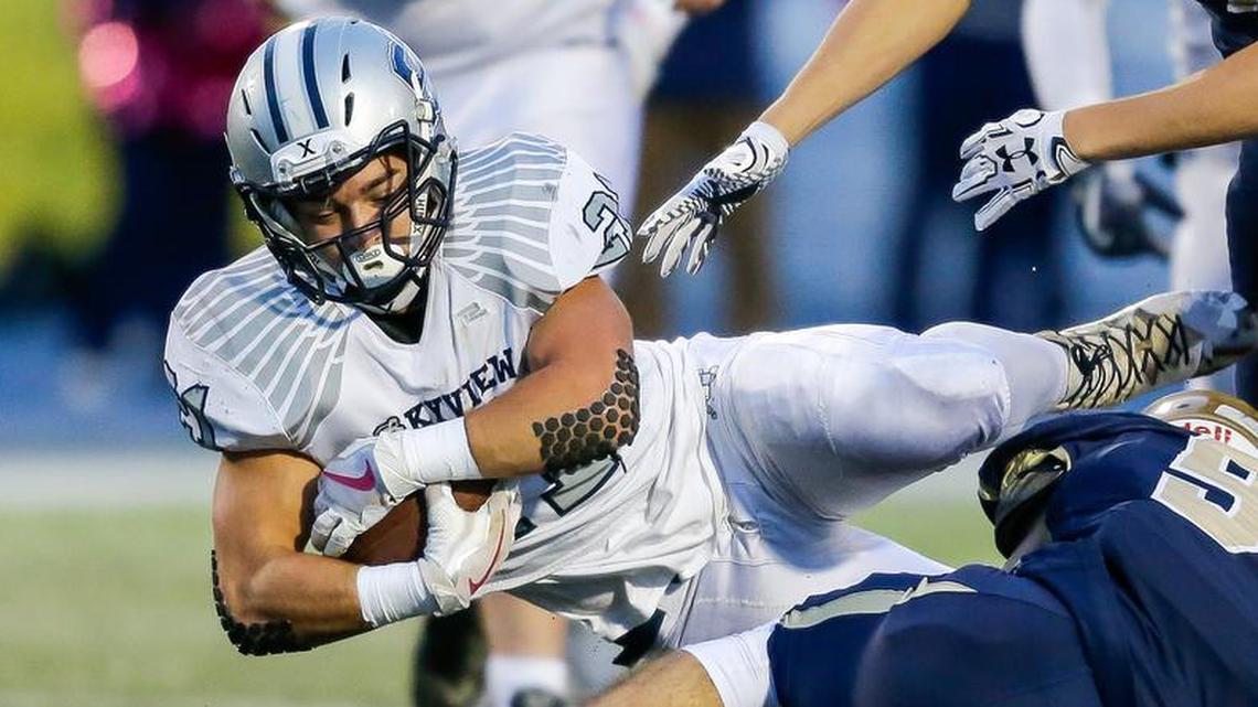 Skyview’s Tyler Crowe (108 yards rushing, 1 TD) dives for a few more yards after being hit by Middleton’s Mitch Beitia.