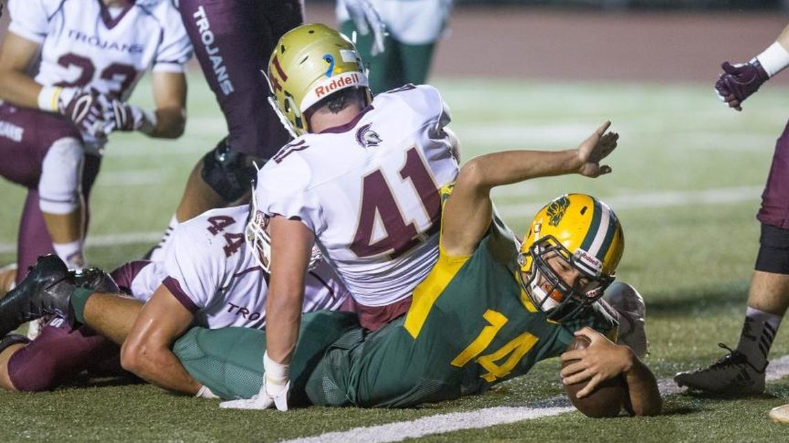 Borah running back Ilaisa Makaafi celebrates a first-half touchdown run against Rigby. But the Trojans stormed back for a 35-21 win Thursday at Dona Larsen Park.