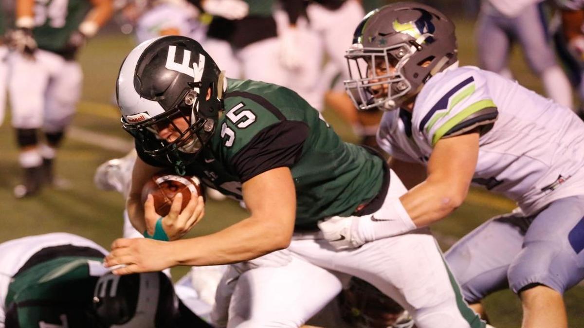 Eagle’s Jonas Loyens fights for extra yards against Mountain View during a 5A state semifinal game on Oct. 28 at Eagle High.