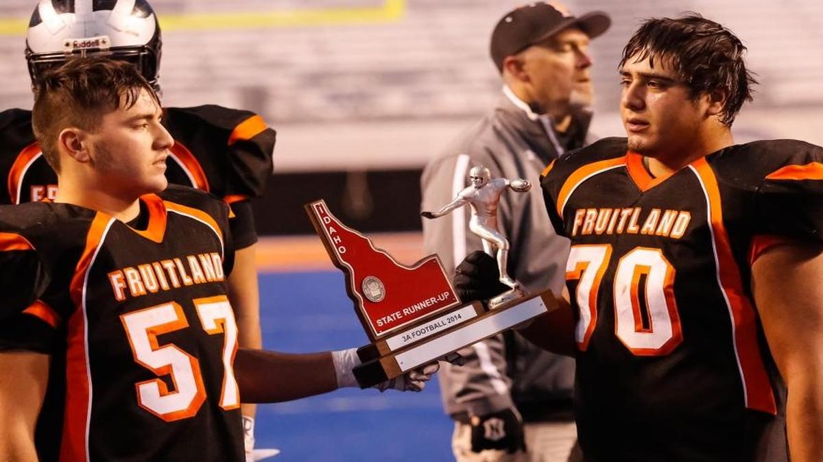Fruitland will play in its 10th 3A state championship game in 11 seasons this Saturday at Albertsons Stadium against Shelley. The Grizzlies have only won twice in that span (2006, 2010). Above: Fruitland’s PJ Allen, left, and Christion Ketchu hold the runner-up trophy after their loss to Snake River in the state final Nov. 21, 2014, at Albertsons Stadium. Snake River won 36-21.
