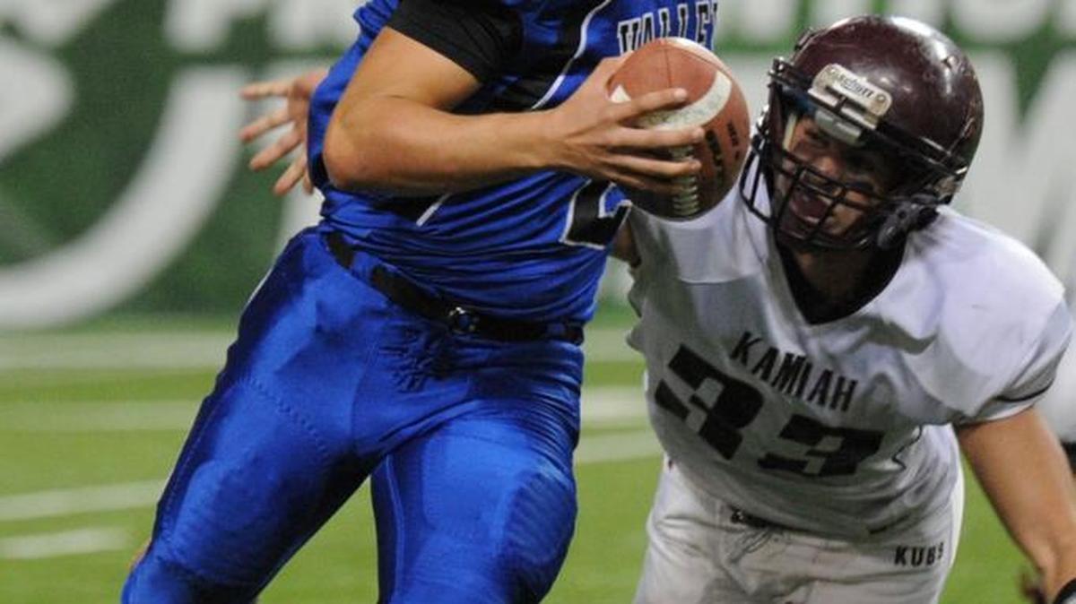 Valley quarterback Ben Taylor escapes a sack against Kamiah in the 1A Division I quarterfinals.