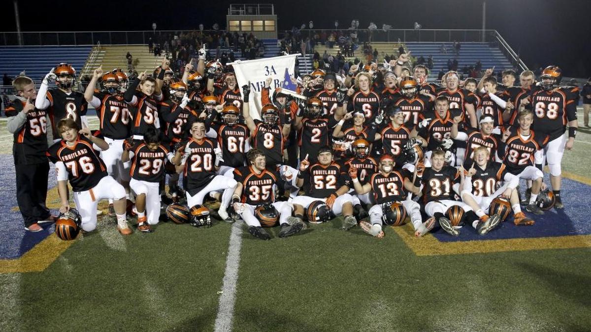 Fruitland poses with the trophy after its win in the 3A state championship high school football game against Shelley last year. Fruitland beat Shelley again Saturday to reach this year’s final.