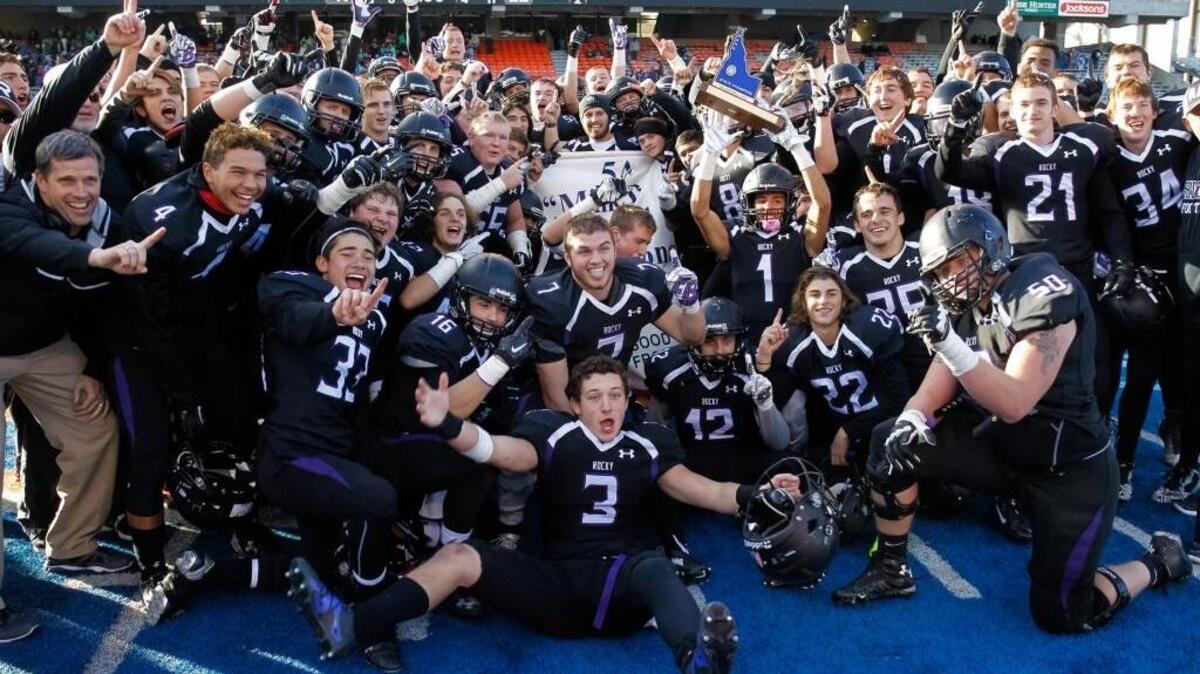 The Rocky Mountain football team celebrates its 41-22 win over Mountain View in the state 5A championship game Saturday at Albertsons Stadium. It was the first in program history for the Grizzlies.