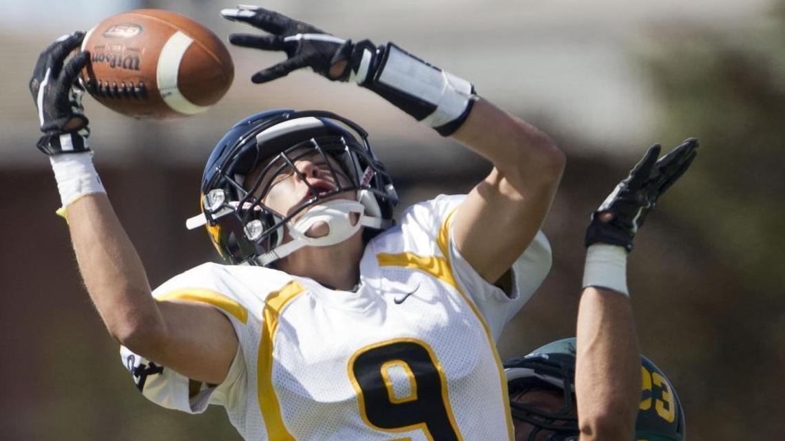 Bishop Kelly wide receiver Vince Sengelmann tries to haul in a pass last year against Borah at Dona Larsen Park.