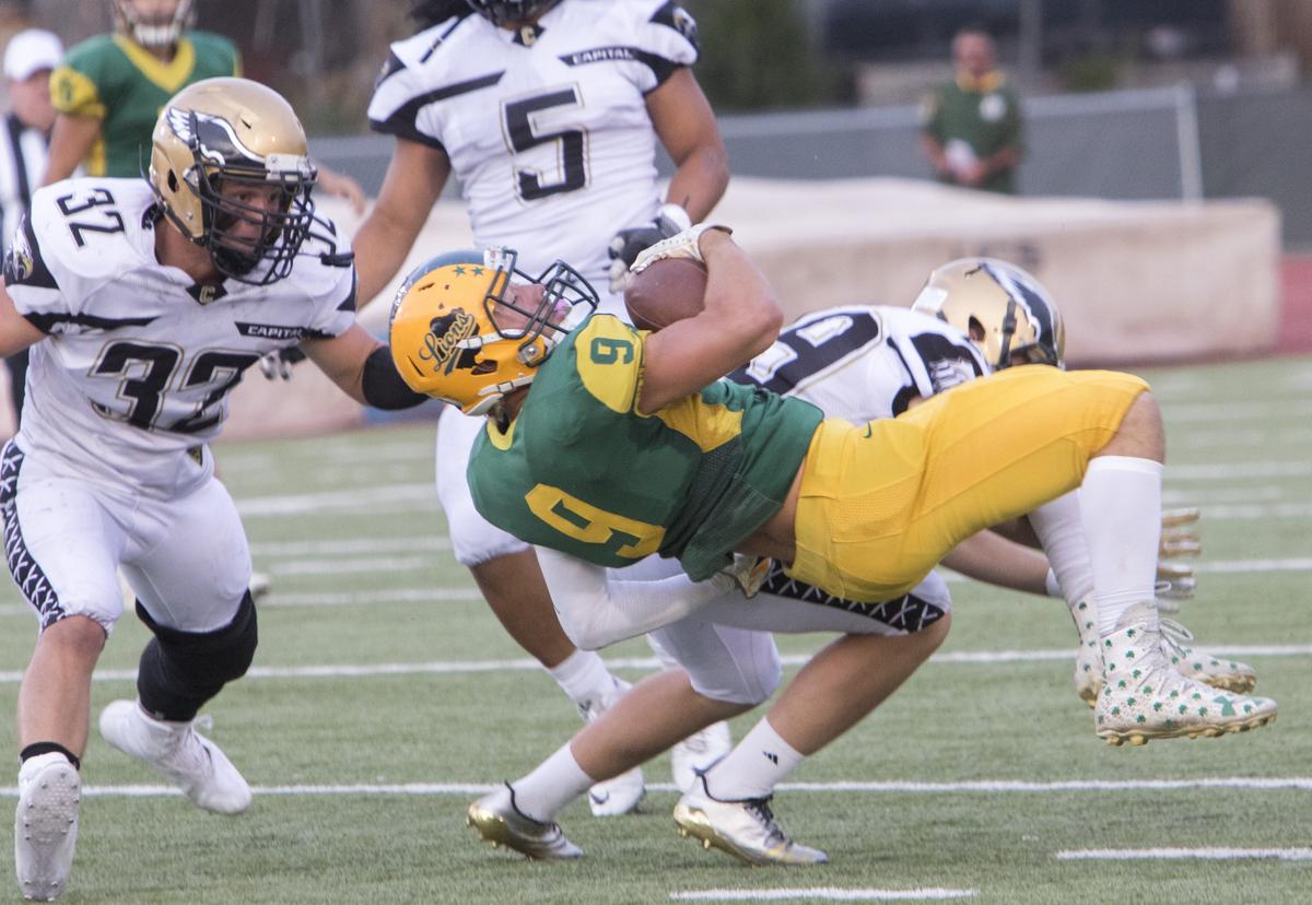 Borah’s Ellis Magnuson gets taken down by Capital’s Cade Larson during the first meeting between the rivals this season. They face off again in the first round of the 5A playoffs Friday at Dona Larsen Park.