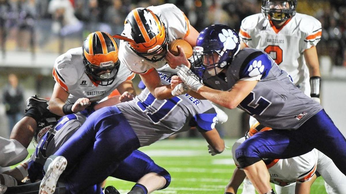 Fruitland quarterback Cole Eiguren goes over the top for one of his two touchdowns in the 3A state championship game Saturday at Pocatello’s Holt Arena.