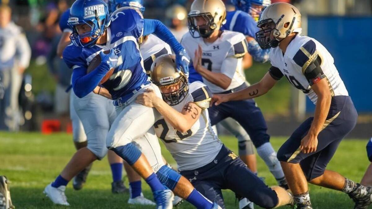 Emmett’s Luc Overton attempts to get away from Middleton’s Jackson Leiby during their game Friday in Middleton.