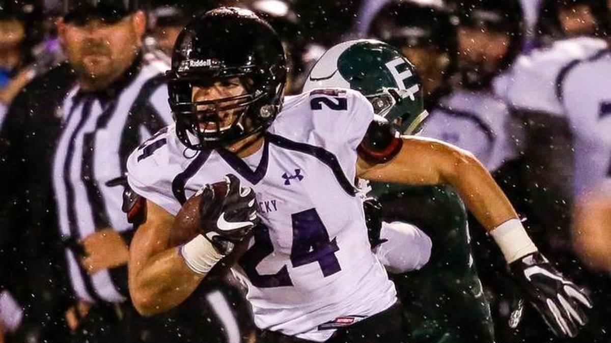 Rocky Mountain’s Nick Romano breaks away on a run from the Eagle defense in the first half of their quarterfinal matchup Friday at Eagle High.