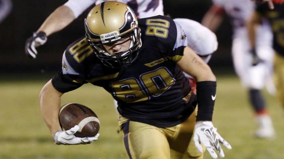 Capital’s Harrison Ashby runs for yards against Madison in a 5A state quarterfinal game Nov. 4, 2016, at Centennial High. Ashby committed to the University of Idaho over the weekend.