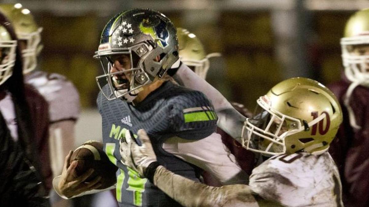 Mountain View quarterback Noah Bryant makes yardage late in the fourth quarter to set up Mountain View’s game-winning touchdown. Bryant passed for 72 yards and rushed for 11 as the Mavericks defeated Rigby 14-13 to advance to the 5A state semifinals.