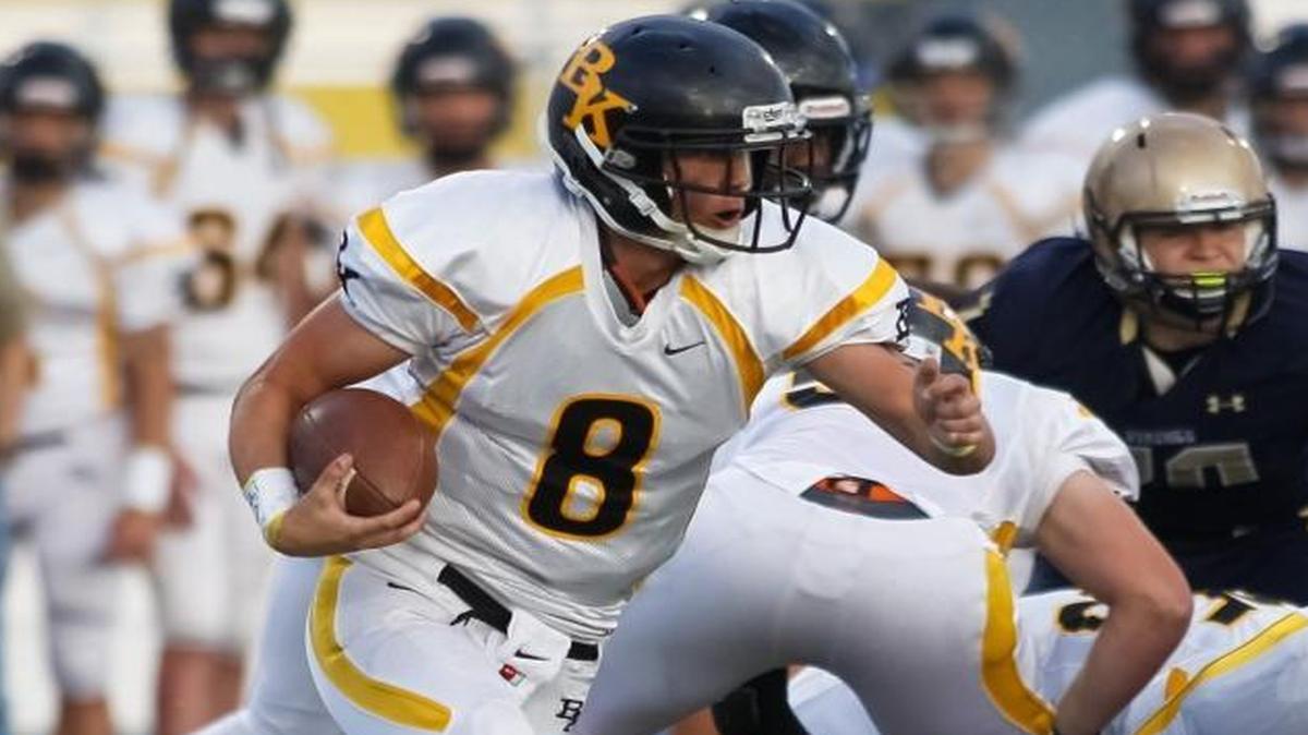 Bishop Kelly quarterback Bronson King runs the ball against Middleton during Friday’s game at Middleton High.