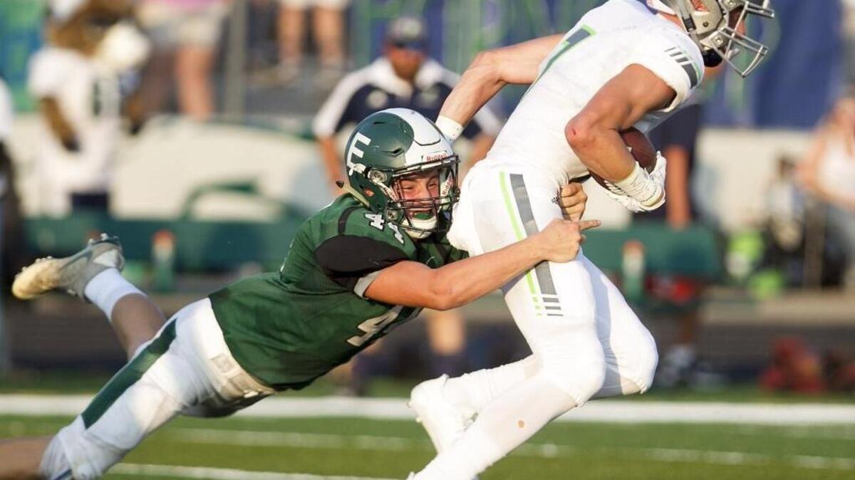 Eagle High’s David Haggerty tackles Mountain View’s Carson Wells during Friday’s game at Eagle. The showdown of powerhouse programs included many new starters on both sides.