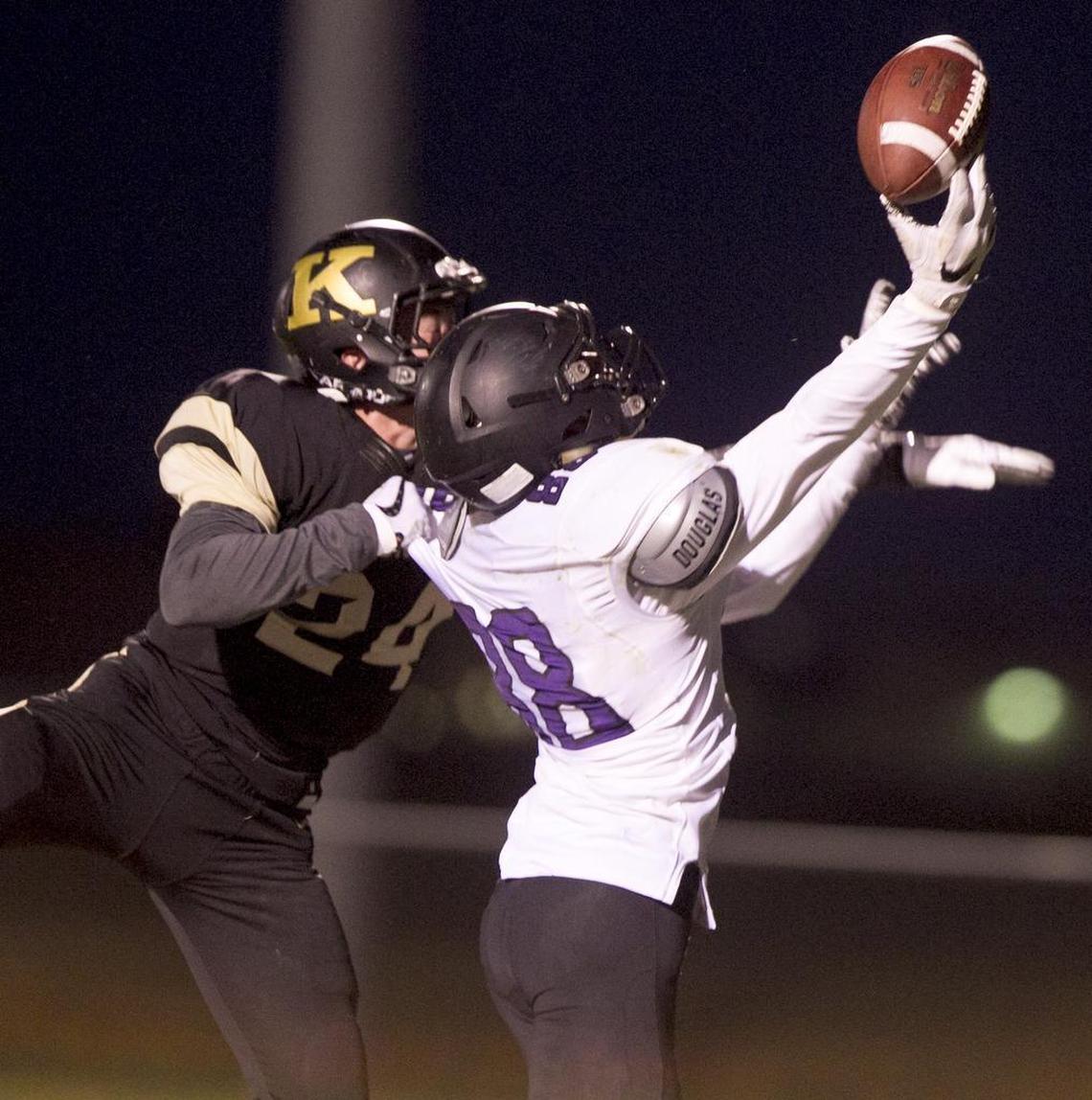 Kuna’s Dalton Bell, left, breaks up a pass in the end zone intended for Rocky Mountain’s Jerrik Lattimer last season.